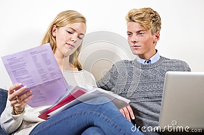 Young couple balancing their checkbook Stock Photo