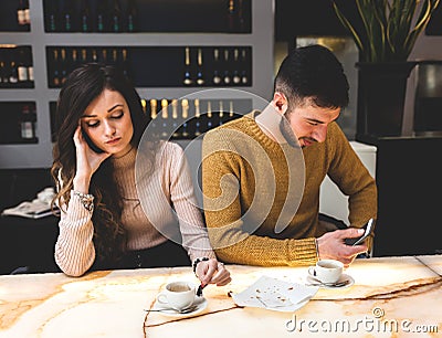 Young couple at the bar. Concept of betrayal Stock Photo