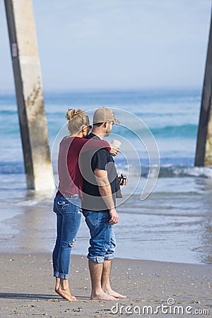 Young couple at the beach Editorial Stock Photo