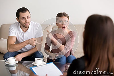 Young couple blaming each other for problems, professional psych Stock Photo