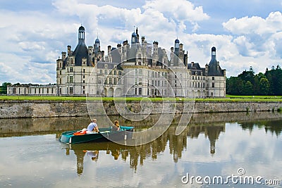 Young couple boating in the canal of the castle Chambord Editorial Stock Photo