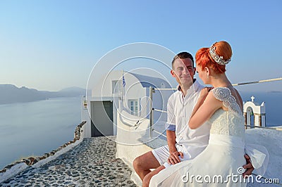 Young couple bride and groom celebrate wedding on Santorini Stock Photo