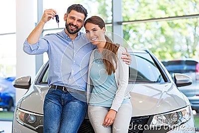 Young couple buying a car Stock Photo