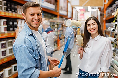 Young couple buying repair tools in hardware store Stock Photo