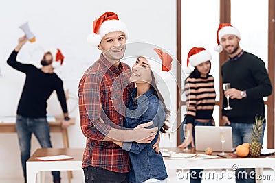 A young couple celebrates at a corporate celebration. Stock Photo