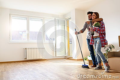 Young Couple Choosing Colors for Painting their Home Stock Photo