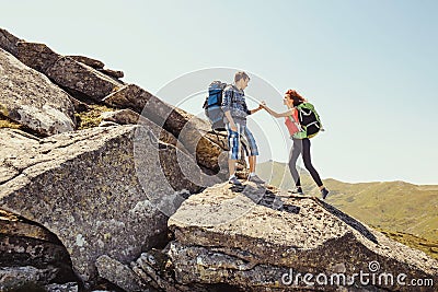 Young couple climbing in the mountains Stock Photo