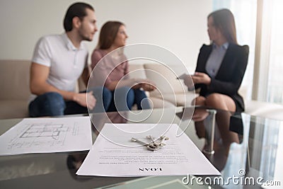 Young couple considering first mortgage, loan agreement for purc Stock Photo