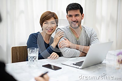 Young couple consulting with professional consultant Stock Photo
