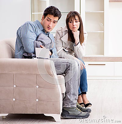 Young couple disappointed with price in furniture store Stock Photo