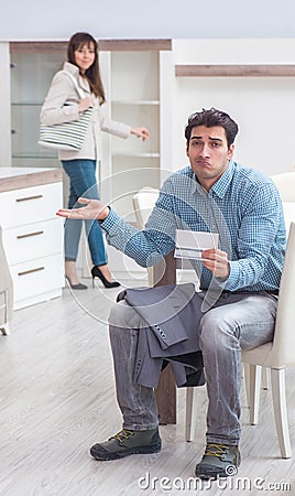 Young couple disappointed with price in furniture store Stock Photo