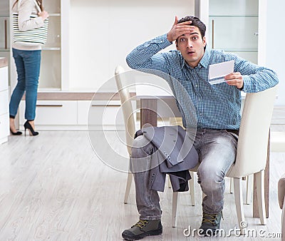 Young couple disappointed with price in furniture store Stock Photo