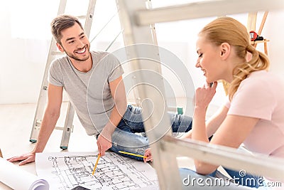 Young couple discussing apartments plan Stock Photo