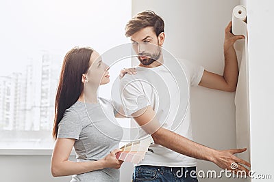 Young couple doing apartment repair together themselves Stock Photo
