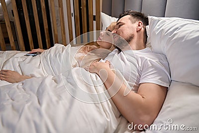 Young couple is dozing in the honeymoon suite Stock Photo