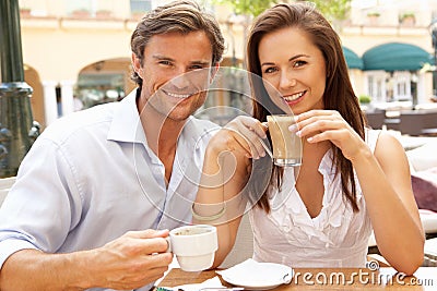 Young Couple Enjoying Coffee And Cake Stock Photo