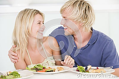 Young Couple Enjoying Meal Stock Photo