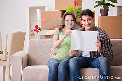 The young couple expecting baby with blank message Stock Photo