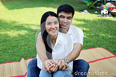 Young couple family relaxation in holiday weekend at garden. Stock Photo