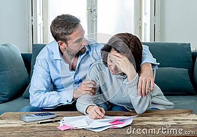 Young Couple Feeling sad and stressed paying bills debts mortgage having financial problems Stock Photo