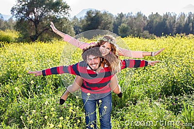 Young couple frolicking in the countryside. Stock Photo