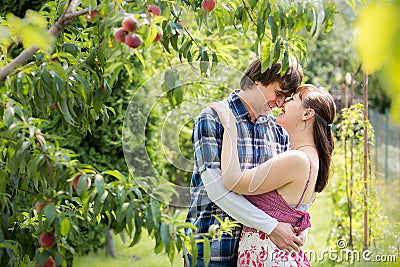 Young couple in garden Stock Photo