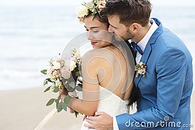 Young couple getting married at the beach Stock Photo