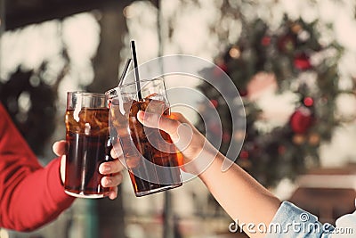 Young couple with glasses of cola, closeup Stock Photo