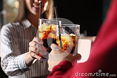 Young couple with glasses of refreshing cola, closeup Stock Photo