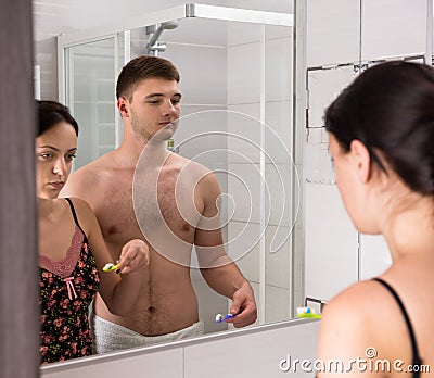 Young couple are going to brush their teeth Stock Photo