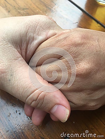 Young couple holding hands close up Multiethnic Multicultural Stock Photo