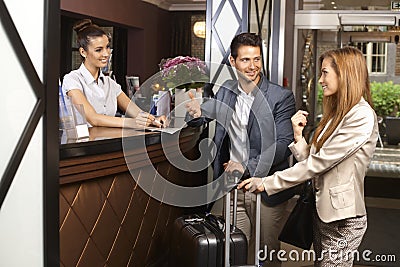 Young couple at hotel reception Stock Photo