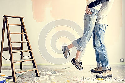 Young couple hugging in renovated house Stock Photo