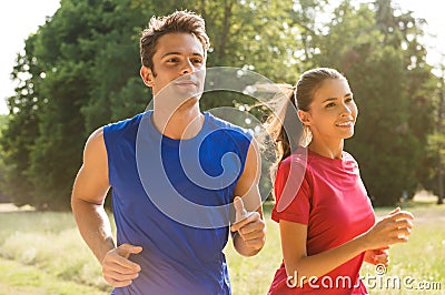 Young Couple Jogging Together Stock Photo