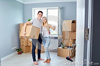 Young couple with keys in new home Stock Photo