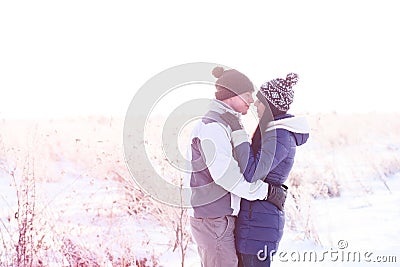 Young couple kissing nature in winter Stock Photo