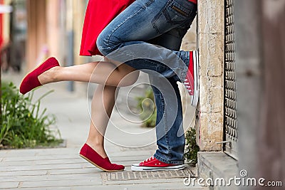 Young couple kissing outdoor. Male and female legs Stock Photo