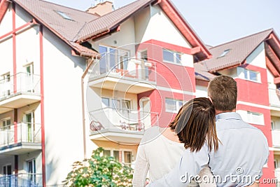 Young couple looking at dream house. Stock Photo