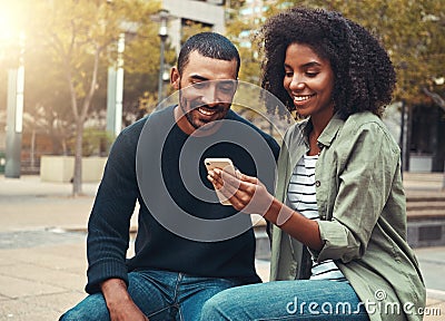 Young couple looking at mobile phone Stock Photo