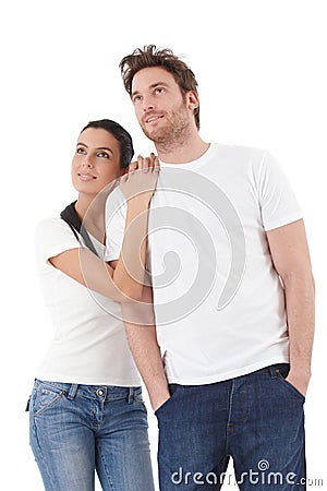 Young couple looking to distance upwards smiling Stock Photo