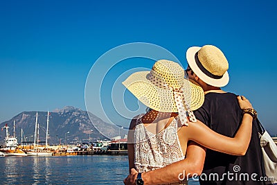 Young couple looks at the Alanya port Stock Photo