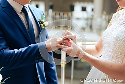 Young couple in love newlyweds exchange gold wedding rings 1 Stock Photo