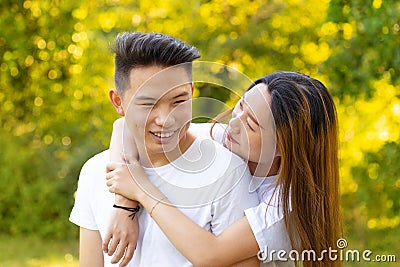 Young couple in love smiles and strolls in the park Stock Photo