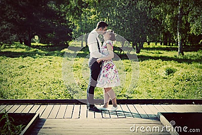 Young couple in love standing on wooden cross-roads Stock Photo