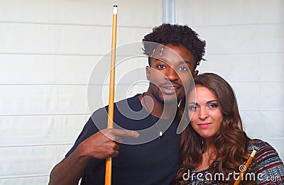 Young man and women friends pool billiards players portrait Stock Photo