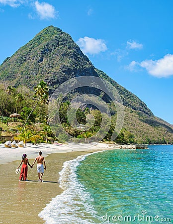 Young couple men and women vacation Saint Lucia, luxury holiday Saint Lucia Caribbean, Sugar beach Stock Photo