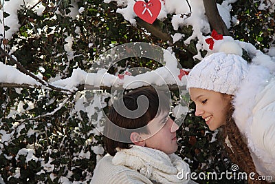 Young couple on natural winter background Stock Photo