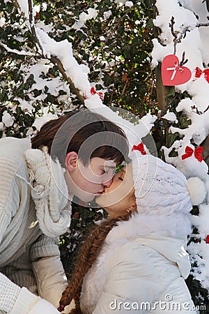 Young couple on natural winter background Stock Photo