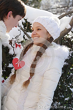 Young couple on natural winter background Stock Photo