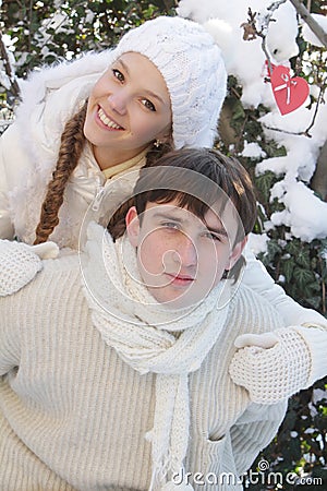 Young couple on natural winter background Stock Photo